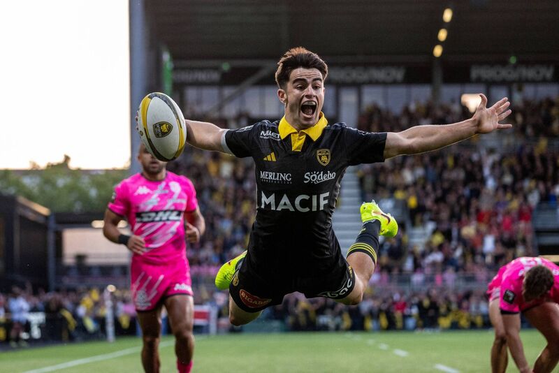 HIGH FLYER: La Rochelle's scrum-half Nolann Le Garrec dives to score the team's first try in their come from behind win against Stade Francais. Pic: Xavier Leoty, AFP via Getty Images