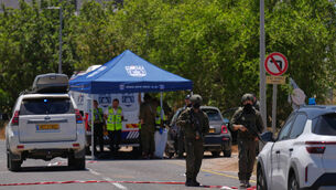 Israeli security forces and rescue service volunteers at the scene of a shooting near Tzur Yitzhak, central Israel (Ariel Schalit/AP) Israeli security forces and rescue service volunteers at the scene of a shooting near Tzur Yitzhak, central Israel (Ariel Schalit/AP)