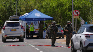 <p>Israeli security forces and rescue service volunteers at the scene of a shooting near Tzur Yitzhak, central Israel (Ariel Schalit/AP)</p>