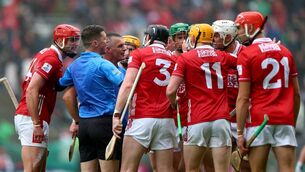 <p>TALKING POINT: Cork players speak to referee James Owens at the final whistle. Pic: James Crombie/Inpho</p>