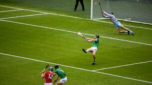 <p class="contextmenu internal_Caption">SOME SAVE: Limerick goalkeeper Nickie Quaid gets his hurley to Diarmuid Healy’s goalbound effort to deflect it outside the post, a crucial stop as it turned out, in Sunday’s Munster SHC final at SuperValu Páirc Uí Chaoimh. Pic: Brendan Moran/Sportsfile</p>