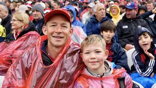 <p>Ryan and Fergus French enjoying the match amid the raindrops at Pairc Ui Chaoimh. Pic: by Noel Sweeney</p> <p>Ryan and Fergus French enjoying the match amid the raindrops at Pairc Ui Chaoimh. Pic: by Noel Sweeney</p>