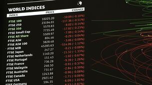 The UK’s FTSE 100 was down about 0.3% in early trading (Jonathan Brady/PA)