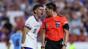 <p>TEAM AMERICA: Christian Pulisic of the United States of America argues with Referee Kevin Ortega. Pic: Jamie Squire/Getty Images.</p>