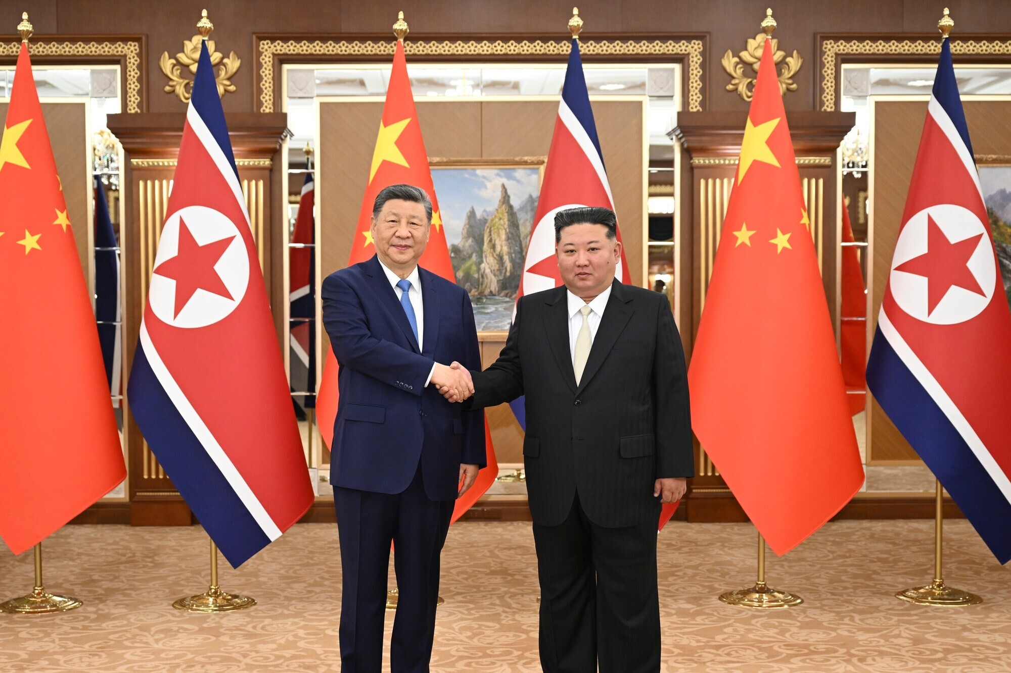 Xi and Kim express hope for greater ties between China and North Korea at summit