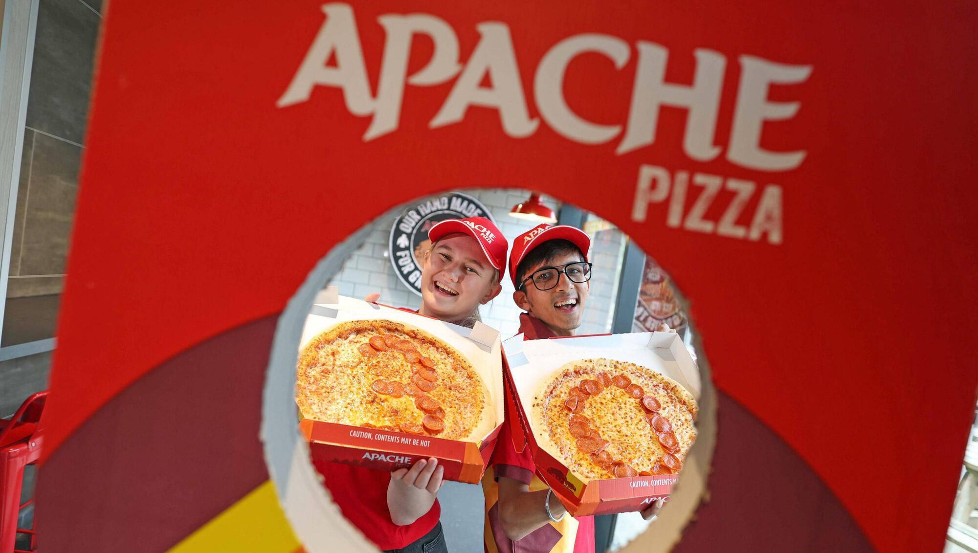 Apache Pizza team members Caitlin Walsh and Amey Vasu at as the company announced it is creating 120 new jobs with the opening of 12 new stores, and giving away free pizza slices from 4pm to 6pm on Tuesday at its 200 stores in Ireland as it celebrates 30 years in business. Picture: Julien Behal