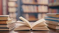 Library, books on table and background for studying, learning and research in education, school or college. Reading, philosophy