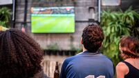 Sports fans watching a match at bar