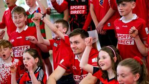 <p>Pupils of Scoil Chroí Íosa, Blarney, pose for a photograph with former pupil and Cork hurler Mark Coleman. Pic: Photo by Brendan Moran/Sportsfile</p>