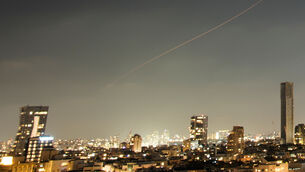 <p>A projectile streaks through the sky over central Israel during an Iranian missile attack, Sunday, June 7 (Ohad Zwigenberg/AP))</p>