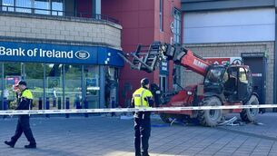 <p>Gardaí at the scene of a robbery at Bank of Ireland in Little Island where a forklift was used. Picture: Dawn O'Connor</p> <p>Gardaí at the scene of a robbery at Bank of Ireland in Little Island where a forklift was used. Picture: Dawn O'Connor</p>