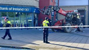 <p>Gardaí at the scene of a robbery at Bank of Ireland in Little Island where a forklift was used. Picture: Dawn O'Connor</p> <p>Gardaí at the scene of a robbery at Bank of Ireland in Little Island where a forklift was used. Picture: Dawn O'Connor</p>