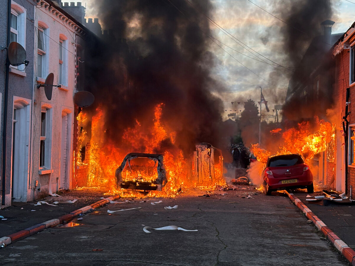Vehicles set on fire by protesters on Lendrick Street in Belfast, as disorder flared in response to Monday night's stabbing attack in the city. Picture: PA Vehicles set on fire by protesters on Lendrick Street in Belfast, as disorder flared in response to Monday night's stabbing attack in the city. Picture: PA