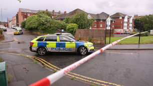 <p>A police cordon at the scene of a stabbing outside apartments in the Kinnaird Avenue area of north Belfast. Picture: PA</p>