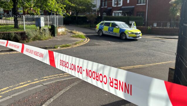 <p>A police cordon at the scene of a stabbing outside apartments in the Kinnaird Avenue area of north Belfast. Picture: PA</p>