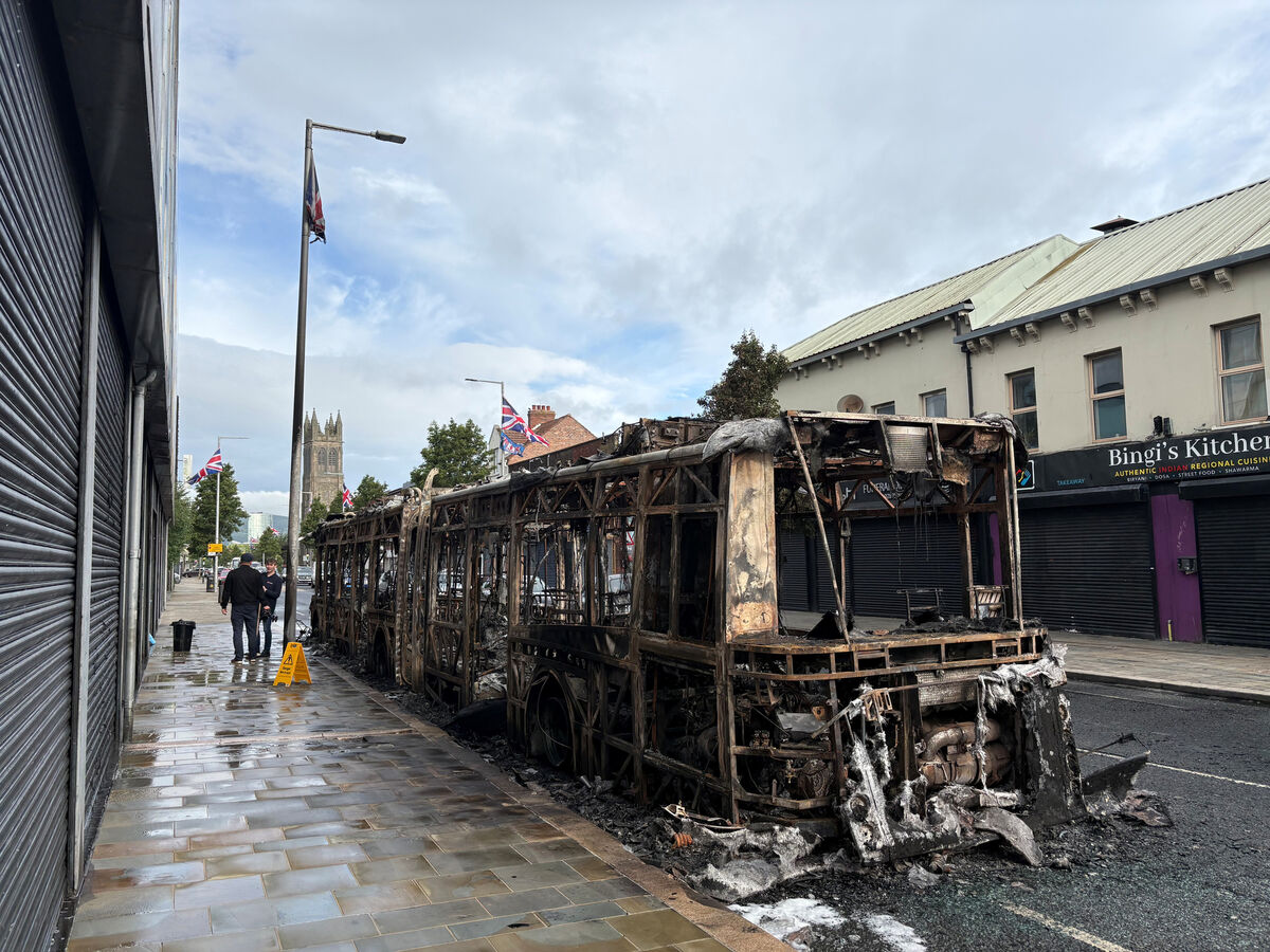 A burned-out Glider bus on Newtownards Road in east Belfast after violence erupted on Tuesday night in the city. Picture: PA A burned-out Glider bus on Newtownards Road in east Belfast after violence erupted on Tuesday night in the city. Picture: PA