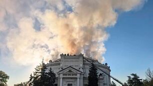 Firefighters put out a fire after a Ukrainian drone attack hit a building housing a huge panorama painting depicting the defence of the city during the 19th century Crimean War in Sevastopol, Crimea (Mikhail Razvozhaev via Telegram/AP)