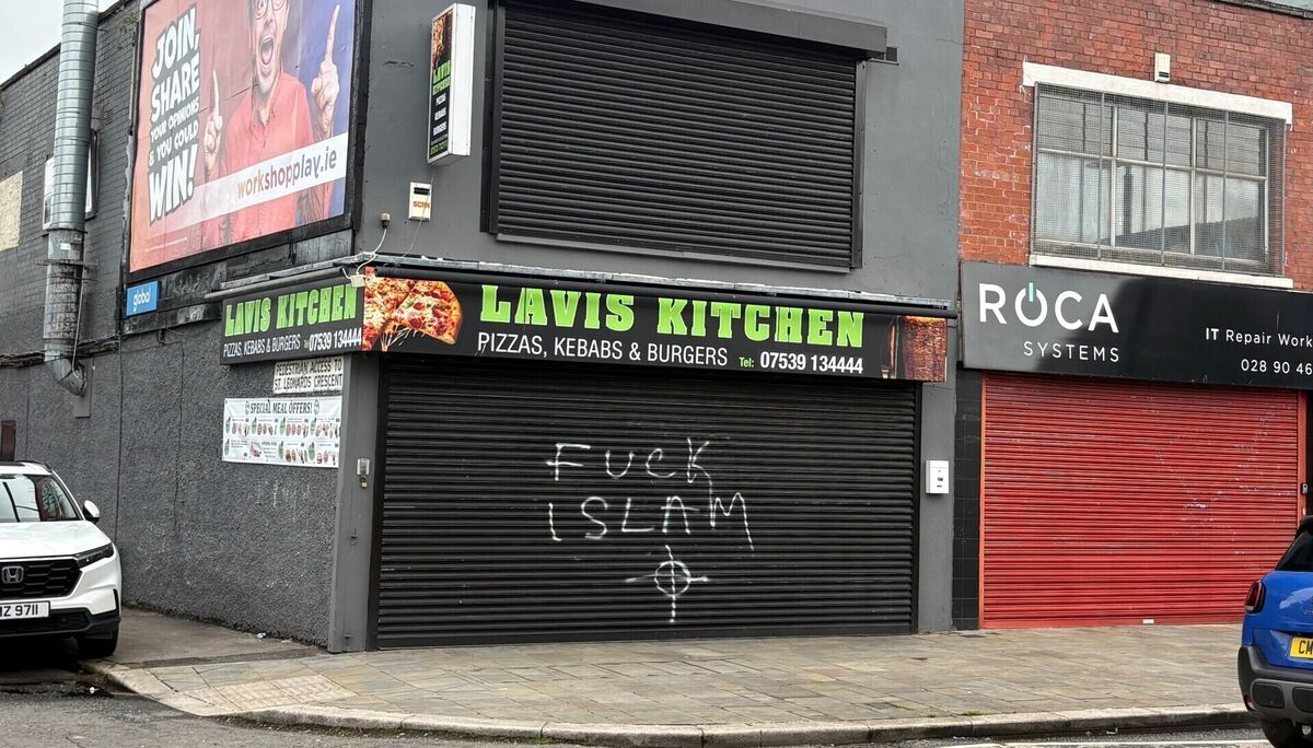 Graffiti spayed on a fast food outlet on Newtownards Road in east Belfast after violence erupted on Tuesday night. Picture: PA Wire Graffiti spayed on a fast food outlet on Newtownards Road in east Belfast after violence erupted on Tuesday night. Picture: PA Wire
