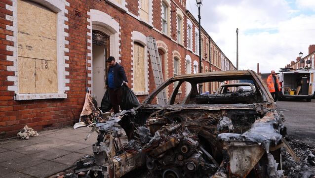 <p>Burned out cars and boarded up houses on McMaster Street in east Belfast after violence erupted on Tuesday night. Picture: Liam McBurney/PA Wire</p>