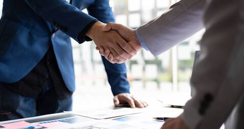 Business partner handshake after the meeting. Financial and investment cooperation.