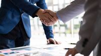 Business partner handshake after the meeting. Financial and investment cooperation.