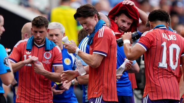 <p>Scotland's Scott McTominay's water bottle comes apart as he sprays himself with water during a cooling break during the international friendly match at the Sports Illustrated Stadium in Harrison, New Jersey. Pic: Andrew Milligan/PA Wire.</p>