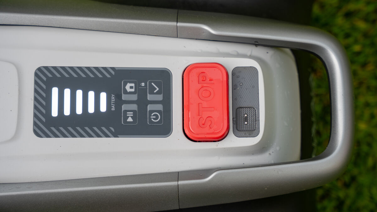 The intuitive top interface of the Eufy E18, including the prominent red emergency stop button for added safety. Picture: Noel Campion The intuitive top interface of the Eufy E18, including the prominent red emergency stop button for added safety. Picture: Noel Campion