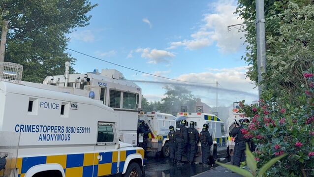 <p>Police fire water cannons at protesters near the Sandyknowes roundabout. Picture: PA/PA Wire</p>