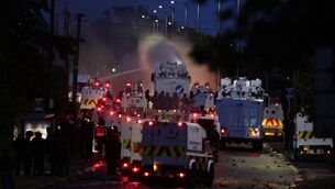 <p>Police fire a water cannon towards rioters after they set fire to wheelie bins and removed a garden fence to use as a shield against the water cannon on Antrim Rd, at the Sandyknowes roundabout in Newtownabbey. Picture: PA</p> <p>Police fire a water cannon towards rioters after they set fire to wheelie bins and removed a garden fence to use as a shield against the water cannon on Antrim Rd, at the Sandyknowes roundabout in Newtownabbey. Picture: PA</p>