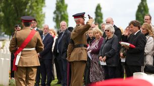 Flags are presented to relatives during a burial ceremony for six British soldiers of the First World War (Virginia Mayo/AP) Flags are presented to relatives during a burial ceremony for six British soldiers of the First World War (Virginia Mayo/AP)
