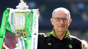 <p>Celtic manager Martin O'Neill celebrates with the trophy after victory in the Scottish Gas Men's Scottish Cup final.</p>