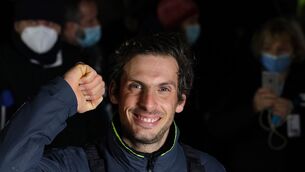French yachtsman Charlie Dalin clenches his fist in Les Sables-d’Olonne (Yohan Bonnet/AP)