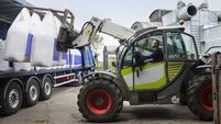 Farmer Receiving  A Delivery Of Nitrogen Sulphur Fertiliser To A Sustainable Farm.