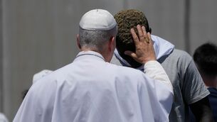 Pope Leo XIV blesses a migrant (Alessandra Tarantino/AP)