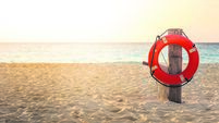 Life preserver on sandy beach