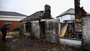 <p>A burnt-out building, following violence by masked protesters in Belfast. Picture: Henry Nicholls/Getty Images</p>