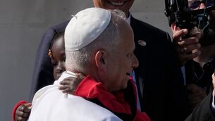 Pope Leo XIV hugs a child during a meeting with migrants in San Cristobal de la Laguna, Tenerife (AP Photo/Alessandra Tarantino)
