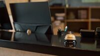 Hotel Reception Desk with Vintage Silver Bell