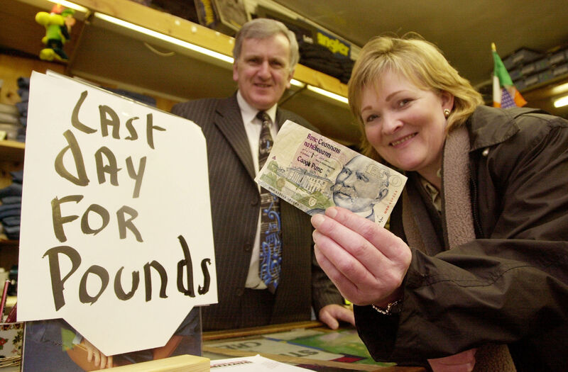 Phil Garvey spends her Irish 50 pound note on clothes in Eamon Geraghty shop in Tuam in February 2002, as Ireland prepared to switch to euro. File picture: Ray Ryan