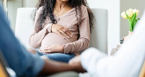 Pregnant Woman in Counseling Session, Expectant Mother