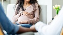 Pregnant Woman in Counseling Session, Expectant Mother