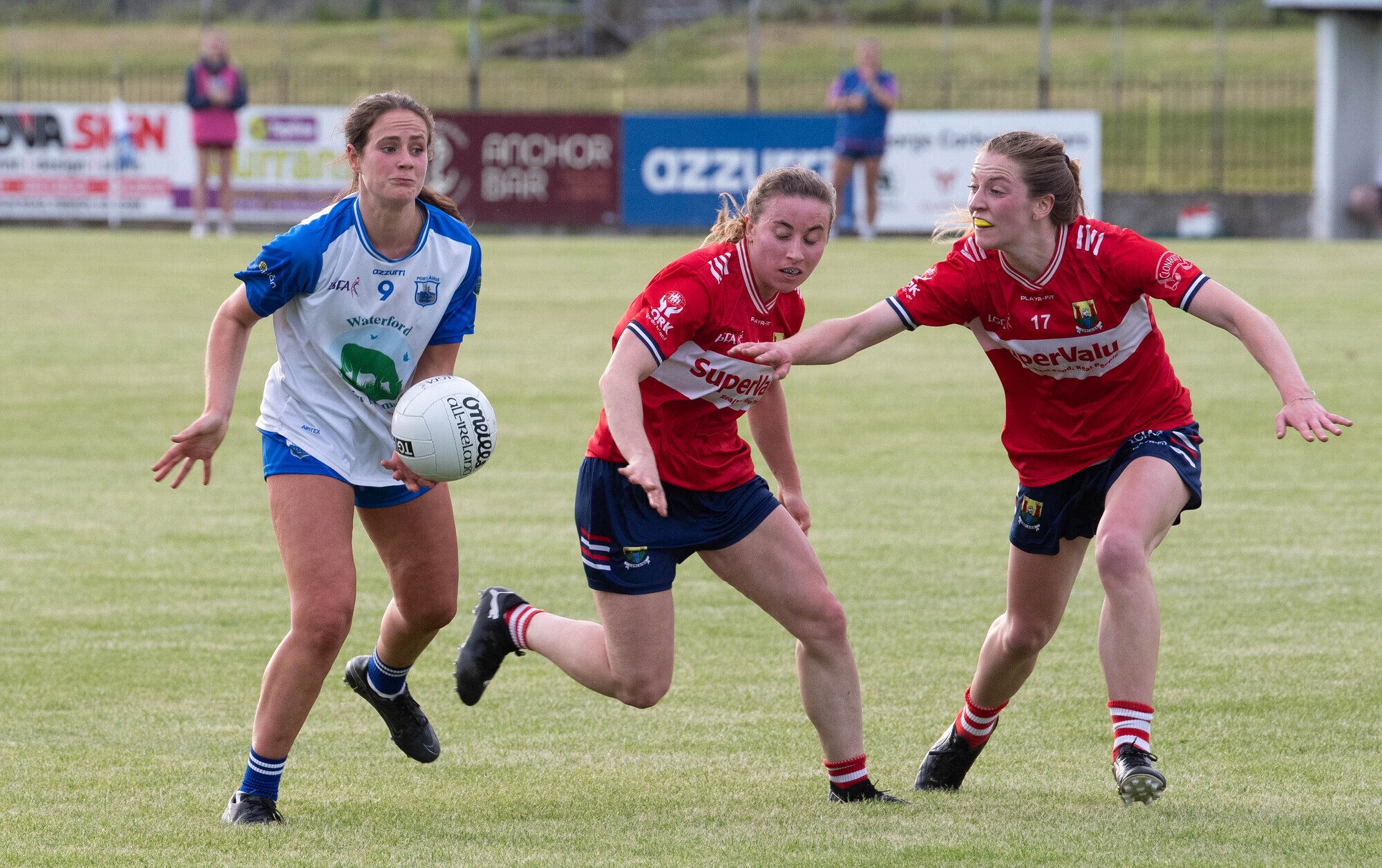 RED SCARE: Waterford's Aine O'Neill about to handpass the ball ahead of Cork players Melissa Duggan and Kate Redmond. Picture: Howard Crowdy