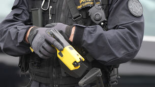 <p>A member of the armed support unit holding a taser at the Garda Headquarters in Phoenix Park (Niall Carson/PA)</p> <p>A member of the armed support unit holding a taser at the Garda Headquarters in Phoenix Park (Niall Carson/PA)</p>