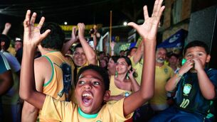 A young fan celebrates in Manaus, Brazil after Brazil scored against Morocco on Saturday (Edmar Barros/AP) A young fan celebrates in Manaus, Brazil after Brazil scored against Morocco on Saturday (Edmar Barros/AP)