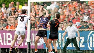 <p>SMASH AND GRAB: Armagh's goalkeeper Ethan Rafferty concedes a goal to Sam Mulroy of Louth. Pic: Laszlo Geczo</p>