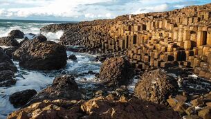<p>The Giant’s Causeway’s distinctive landscape was formed during intense volcanic activity which forced molten rock up through cracks in the earth</p>