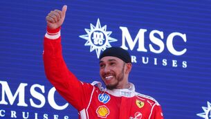 <p>BACK ON TOP: Ferrari driver Lewis Hamilton celebrates on the podium after winning the race at the Circuit de Barcelona-Catalunya. Pic: David Davies/PA Wire.</p>