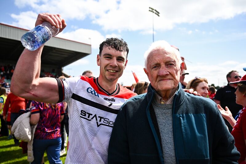 Craig Lennon of Louth celebrates with his grandfather Stephy Gernon after the victory over Armagh. Pic: Ben McShane/Sportsfile
