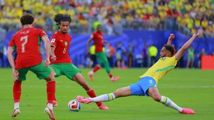 <p>STRETCHING: Moroccan winder kid Ayyoub Bouaddi evades the lunging challenge of Brazil's Matheus Cunha in their 1-1 Worlkd Cup draw in New Jersey on Saturday. Pic: Hugo Rivera/Jam Media/Getty Images</p>