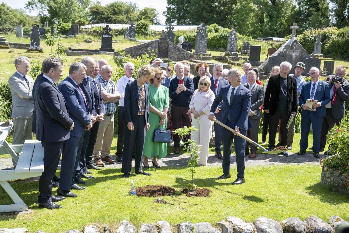 Canadian Prime Minister Mark Carney plants an oak tree during his visit to Aughagower. Picture: Andrew Downes/PA Canadian Prime Minister Mark Carney plants an oak tree during his visit to Aughagower. Picture: Andrew Downes/PA